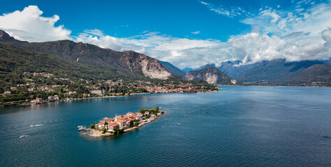 Stunning view of Lake Maggiore with isola dei pescatori and mountains under a bright sky