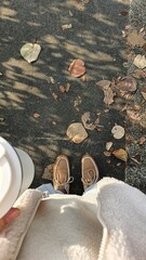 A girl walks down the street, beautiful autumn weather sunlight tree shadows that sway with my...