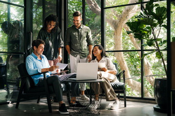 Mixed team of software engineers brainstorming ideas. Diverse app developers collaborating as group