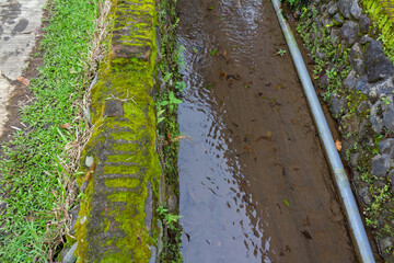 Pipeline in Small Rural Asian River Stream