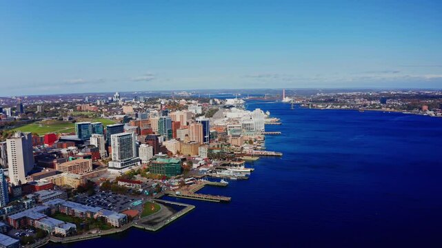 Aerial drone shot over Halifax downtown, Nova Scotia, Canada.
High view of the cityscape, ocean and the urban buildings.