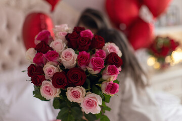 Special Bond: Mother and Daughter Embrace Flowers in a Cozy Setting