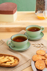 Green mug and saucer on the kitchen table
