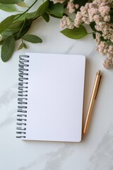 Naklejka premium A notebook and pen are on a table with a bunch of flowers. The notebook is open to a blank page, and the pen is sitting on top of it. The flowers are scattered around the notebook