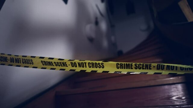 Police Crime scene 'Do not cross' tape cordon's off stairs entrance