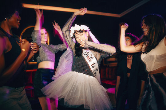 Bride-to-be celebrating with friends during her lively bachelorette party night