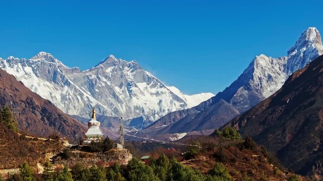 Aerial view capturing Mount Everest towering over tranquil Nepalese landscape, sacred Buddhist stupa highlighting regional spiritual heritage in Namche Bazaar