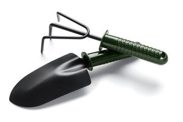 Shovel and rake on white background. Gardening tools