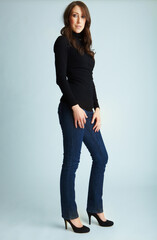 Woman, smile and fashion in studio portrait, confidence and pride with stilettos by background....