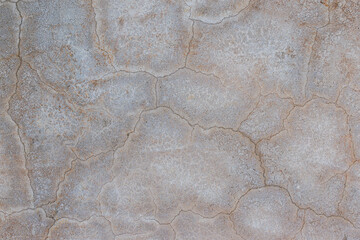 Texture gray cement wall with black stain and cracks