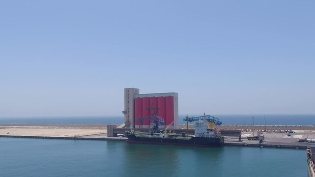 Moroco Agadir apr 24 2024 Large Cargo Ship Docked at Busy Port with Cranes
