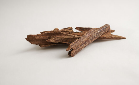Premium Agarwood Sticks isolated on white background &ndash; Used in Traditional Perfume and Incense
