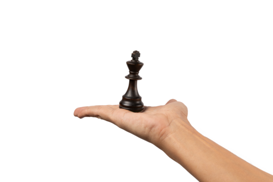 Male hand offering a a black king chess figure isolated no background
