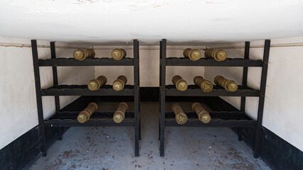 This image depicts a clean and organized military equipment storage bunker featuring several shelves filled with munitions, highlighting preparedness and defense.