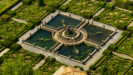 Fototapeta premium Aerial view of a beautiful fountain inside a decorated garden of a beautiful villa with park. It is located in Bagnaia, In the province of Viterbo, Italy.