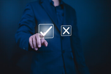 Yes or No decision idea. Checklist option communication, Businessman showing  icon yes noin front, is future decisionof him to decide on your own path, Decide to vote accept or not, True False