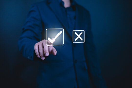 Yes or No decision idea. Checklist option communication, Businessman showing icon yes noin front, is future decisionof him to decide on your own path, Decide to vote accept or not, True False