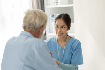 Fototapeta premium Nurse and elderly, nursing home. Nurse caring elderly man sitting on bed at hospital. Asian nurse taking care of senior man at nursing home. People and health care concept