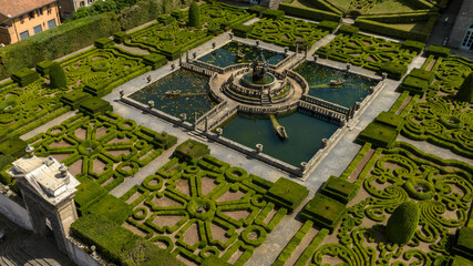 Aerial view of a beautiful fountain inside a decorated garden of a beautiful villa with park. It is located in Bagnaia, In the province of Viterbo, Italy.
