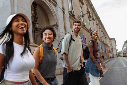 Happy tourists walking and exploring city center