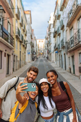 Group of happy tourists taking a photo of themselves in lisbon, portugal