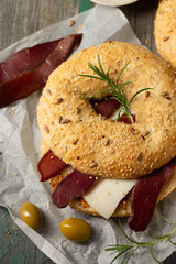 Burger with cheese, basturma and olives