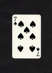 A spades playing card isolated on a black background.