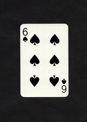 A spades playing card isolated on a black background.