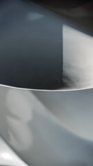 blue and gray abstract background from curved lines of geometric shapes