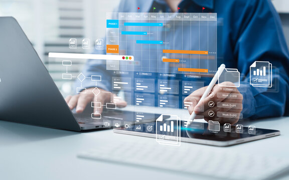 Project management tool concept. Business people use laptop to manager working projects and update task with Gantt chart schedule to Business plan and progress. Planning software.