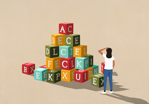Confused woman looking at large stack of alphabet blocks
