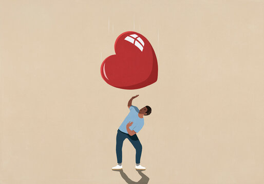 Large red heart falling over surprised man
