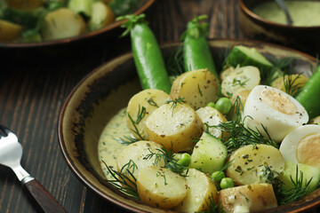 A bowl with farming summer salad in rustic style