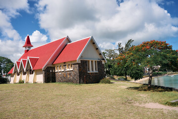 Fototapeta premium Scenic landmarks of tropical Mauritius – the iconic red-roofed church on the beach at Cap Malheureux