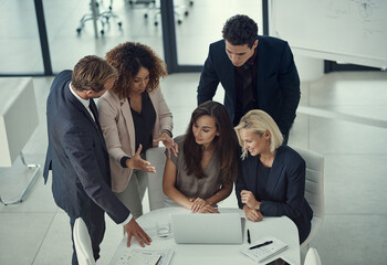 Discussion, business meeting and people with laptop, online and brainstorming with technology. Boardroom, colleagues and group with info for project, planning and teamwork for ideas or top view