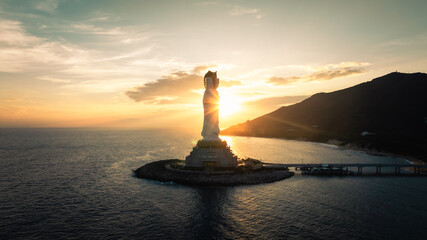 Guanyin statue at seaside in nanshan temple, hainan island , China. Words mean mercy and blessing.