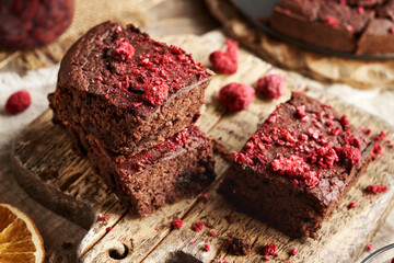 Homemade gluten-free brownies made with red kidney beans, oat flakes, and freeze-dried raspberries