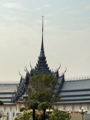 Fototapeta premium Detailed temple spire rises against a clear sky highlighting cultural artistry