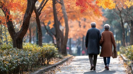 An elderly couple walking in a park, enjoying a financially secure retirement, copy space on the left.