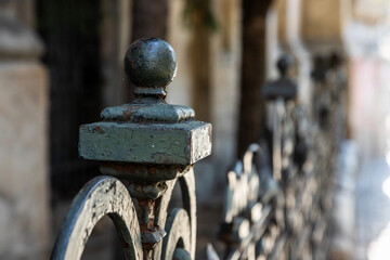 Intricate details of a wrought iron fence typical of Bucharest showcasing craftsmanship and historic charm in Romania's vibrant cityscape