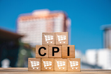 CPI, consumer price index symbol. Wooden blocks with words CPI, consumer price index on dollar...