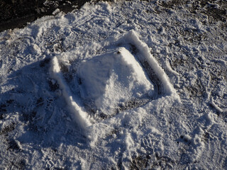Snow Pyramid in Square Frame on Ground, Winter Abstract Minimalist Composition