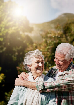 Nature, senior couple and happy together in garden with bonding, commitment and support in retirement. Love, elderly people and embrace in backyard with romance, loyalty and affection in relationship