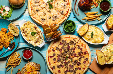 Delicious Assorted Western Food on a Rustic Blue Table
