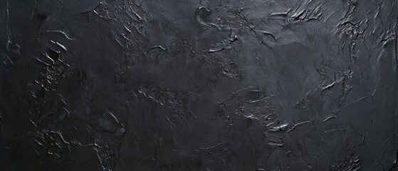 Fototapeta premium Black textured wall background, dark surface for design, abstract pattern, moody ambiance, versatile for presentations, photography, and digital projects.