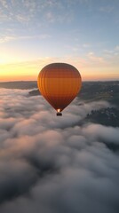 Obraz premium Hot Air Balloon Soaring Above Clouds at Sunrise With Vibrant Colors