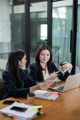 Professionals analyzing financial documents and collaborating on strategy in a bright office.