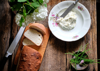 whipped chives butter. Serving, homemade loaf, side view.