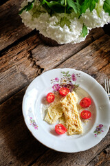 omelette roll with cheese and tomatoes