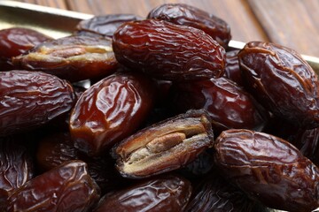 Many tasty dried dates on table, closeup